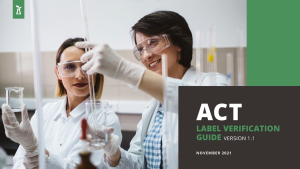 lab workers with ACT standard guide