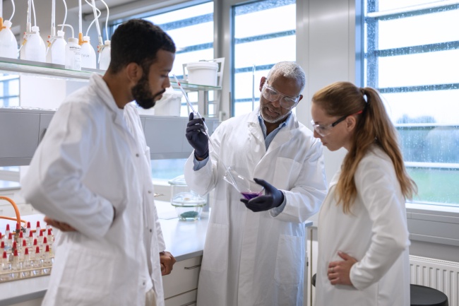Students and employees in a chemical laboratory during the study process and during the regular work of a researcher at a chemical university.