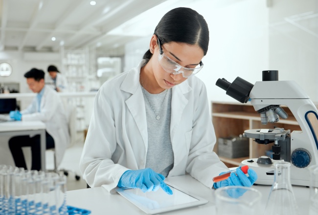 AP hero scientist women and test tube tablet