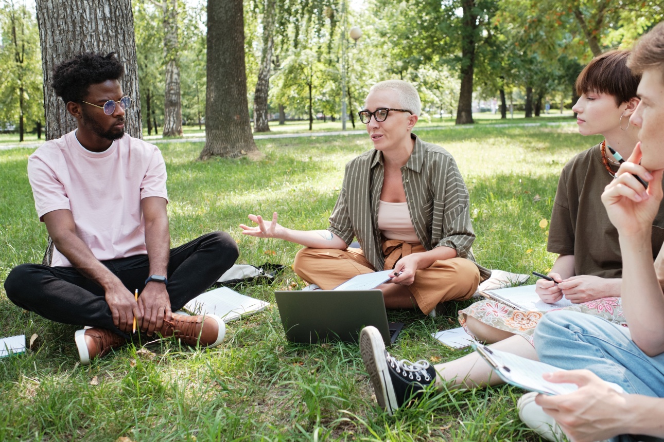 group of young people in the grass