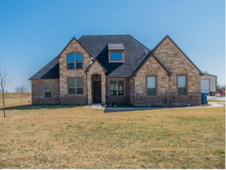 brick house with grass