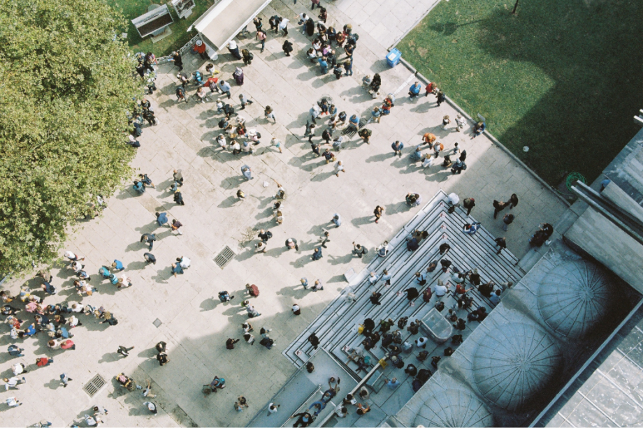 Aerial view of people gathering, symbolizing community.